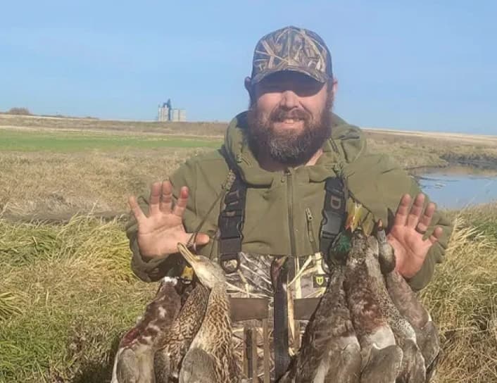 Hunter with game birds